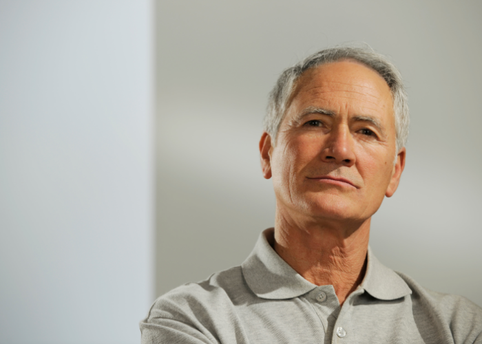 Older man looking straight