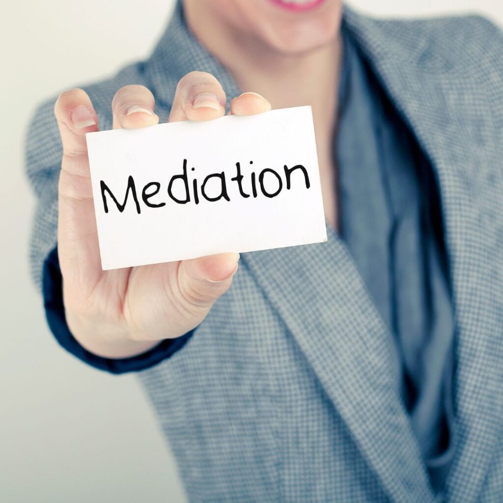 Woman holding mediation sign