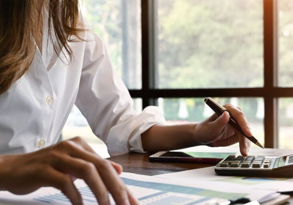 Woman calculating bills.