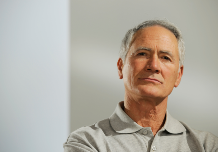 Older man looking straight