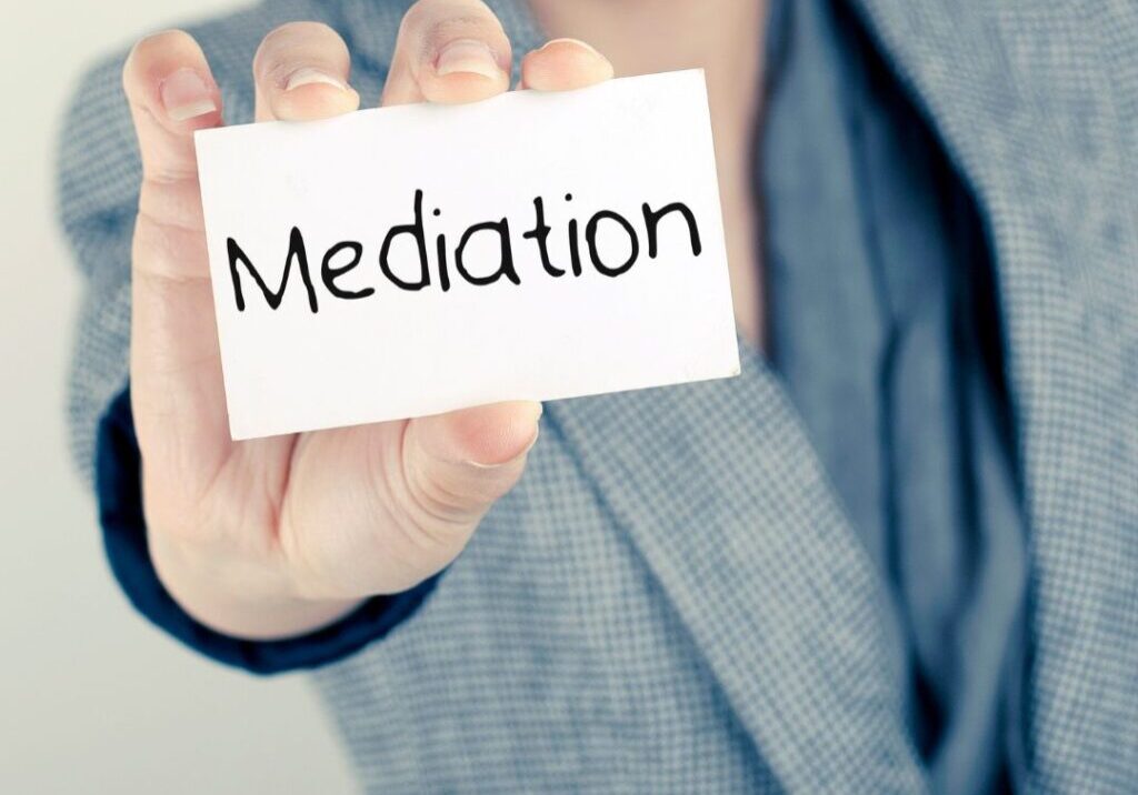 Woman holding mediation sign