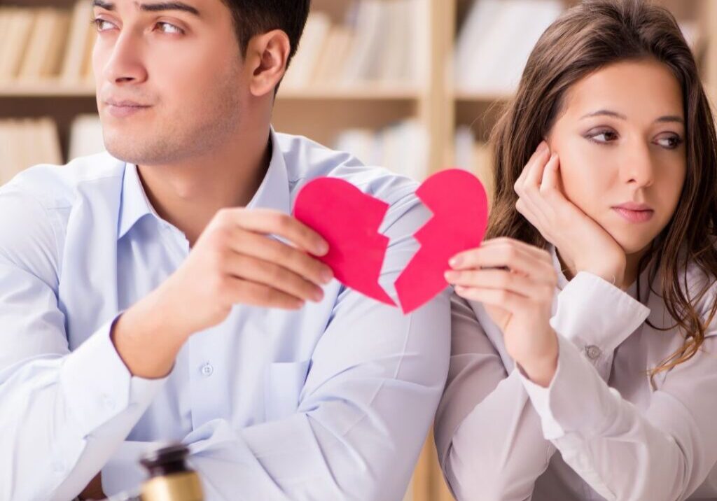 Couple holding broken heart
